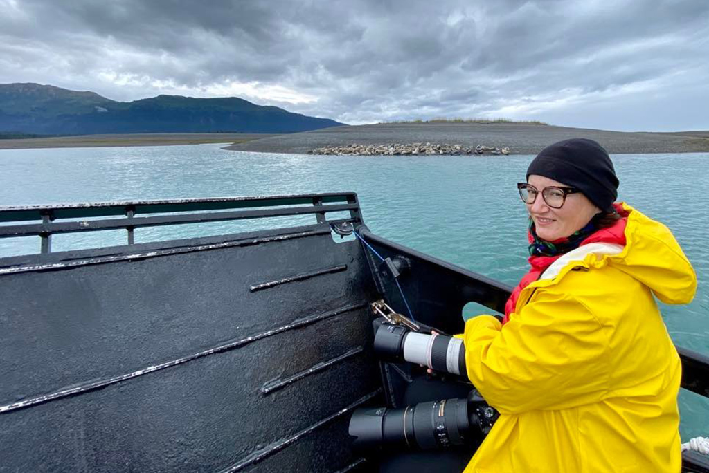 Agnes taking pictures from water taxi during wildlife tour in Homer.