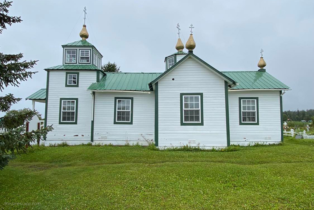 wooden white and green buildling of the historical Orthodox church in Ninilchik, great stop during Alaska RV trip.