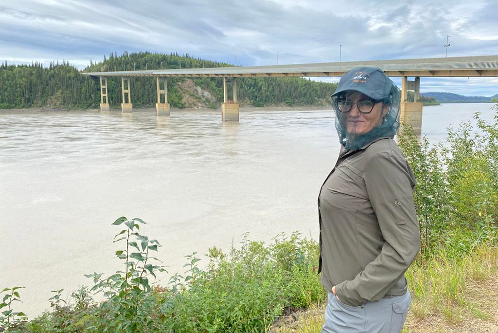 Agnes in mosquitoes head net during Alaskan summer.