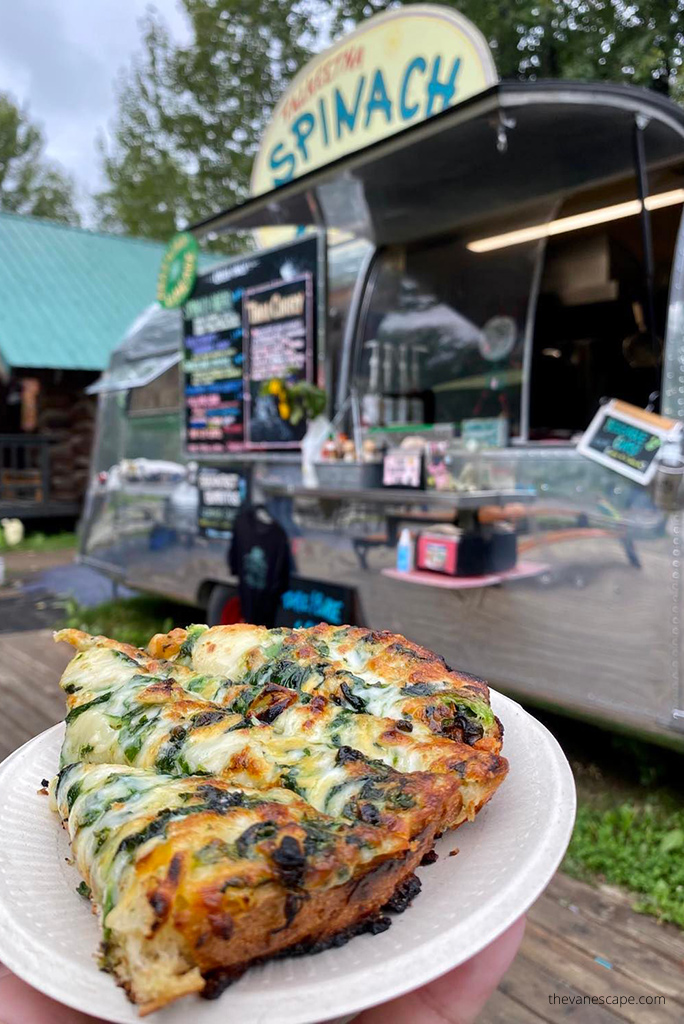 Agnes eating Spinach Bread from Fun & Tasty Food Truck.