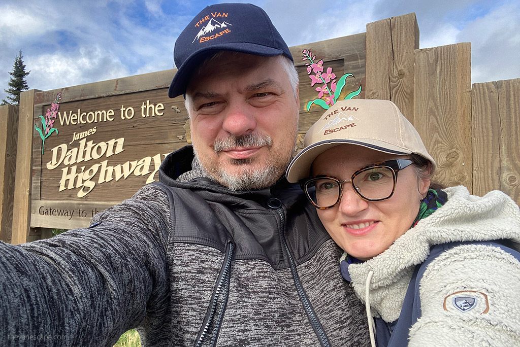 Agnes Stabinska, the author, with her partner Chris next to the Dalton Highway sign.
