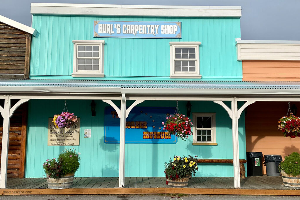 Historic building in Pioneer Park in Fairbanks: bleue painted wooden carpentry shop.