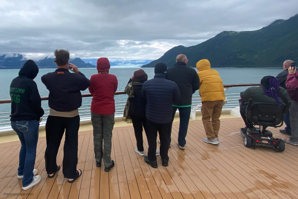 People on a cruise ship in Alaska during windy and rainy day.