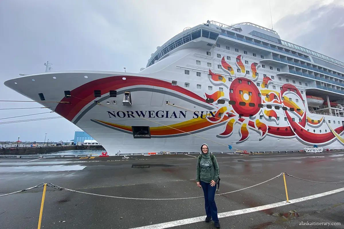 Agnes standing in front of Norwegian Sun cruise ship.