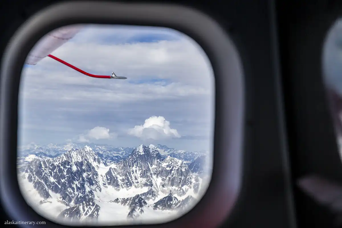 The view from small plane window during scenic flight over Denali.