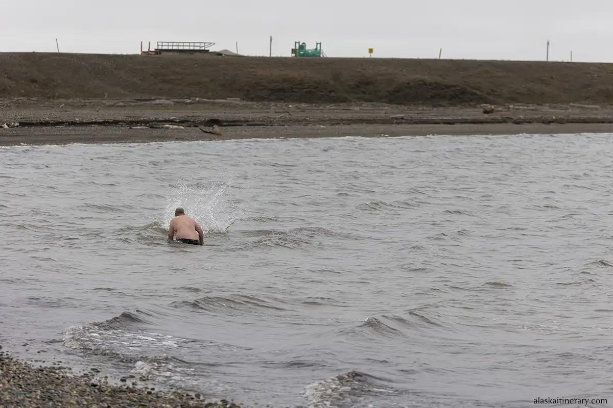 Our Guide taking a Polar Dip in the Arctic Ocean at Prudhoe Bay.