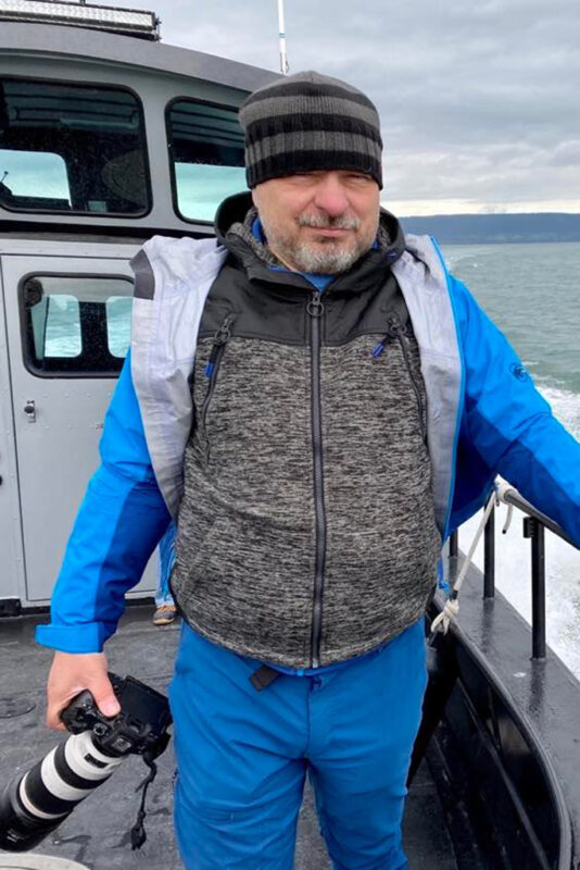 Chris with his camera teking pictures during our Katchemak Bay wildlife tour.