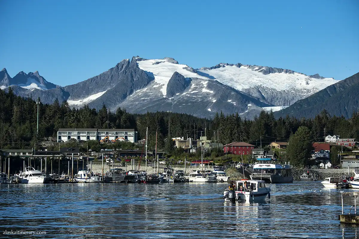 Auke Bay Harbor in Juneau with mountains nad glaciers in the backdrop.