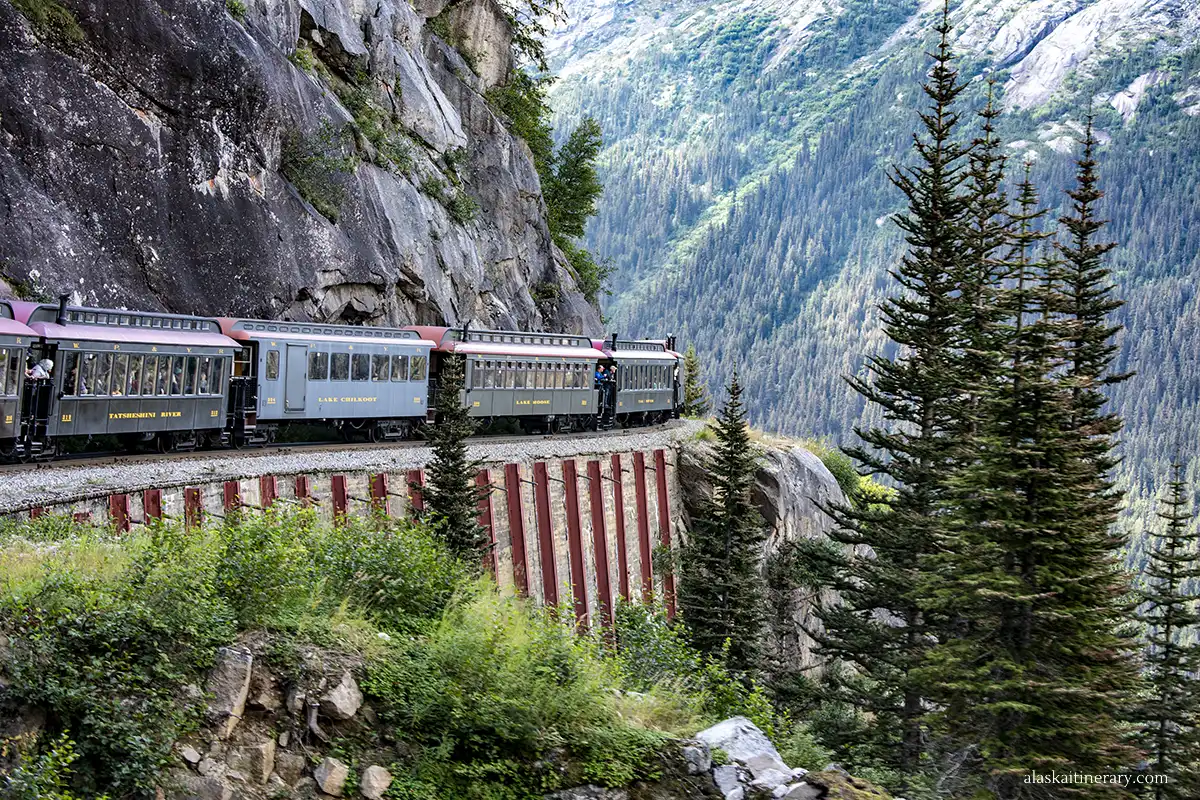 Scenic White Pass train ride in Skagway: train with the mountains in backdrop. 
