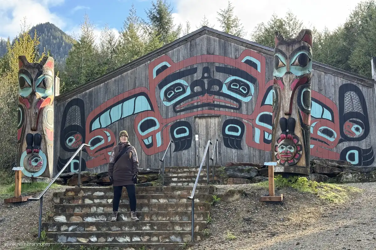 Agnes Stabinska, the author, next to totem poles in Ketchikan.
