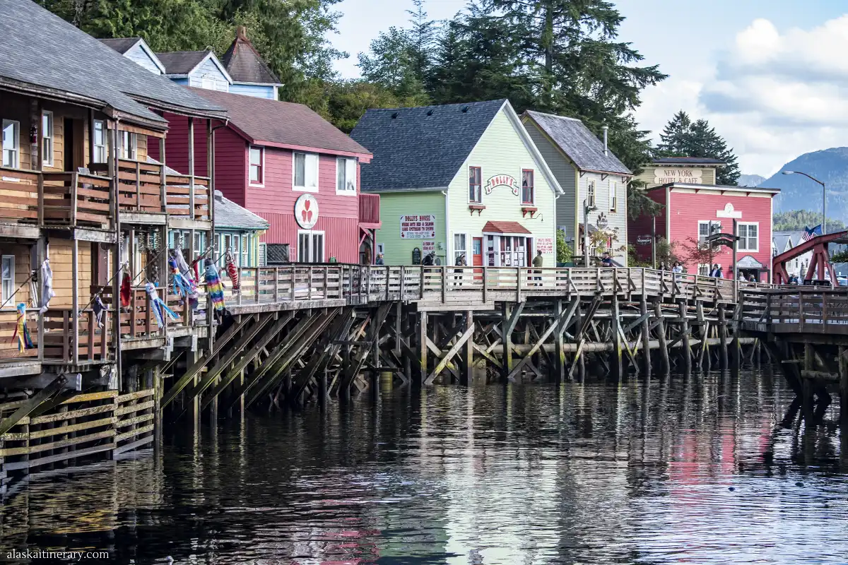 Famous Creek Street in Ketchikan wit colorful wooden houses in pastel shades on wooden stilts suspended above the creek. 