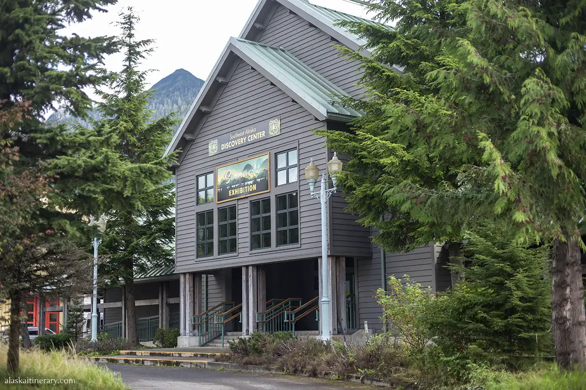 Building of Southeast Alaska Discovery Center in Ketchikan among gree trees.
