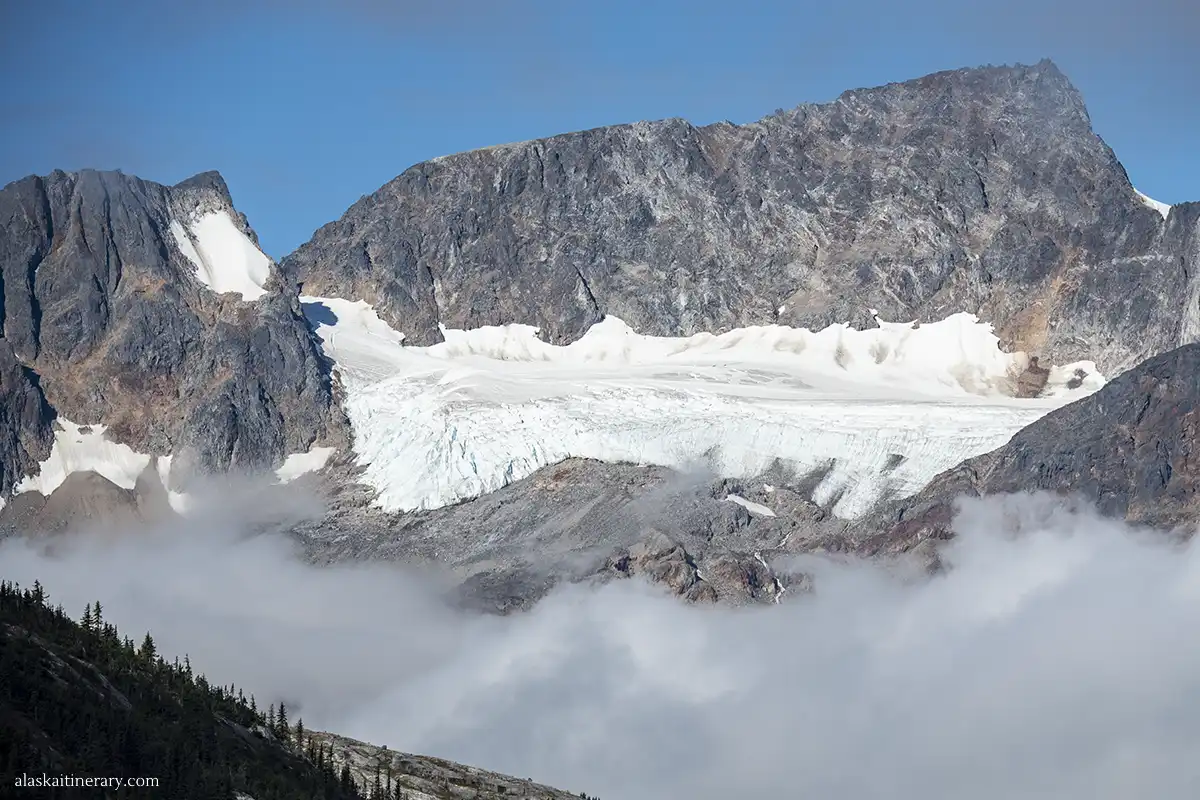 Skagway facts: a glacier with mountain peaks and mist.