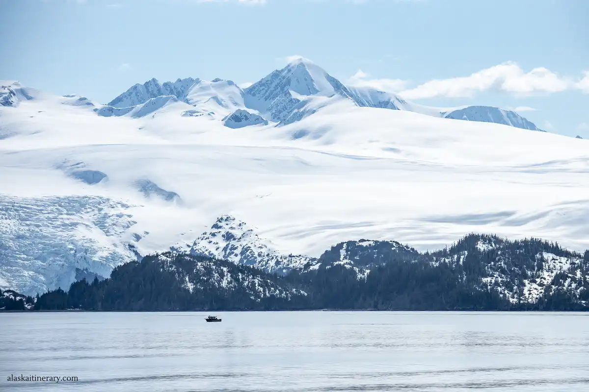 small vessel with the Prince William Sound Glaciers in the backdrop.