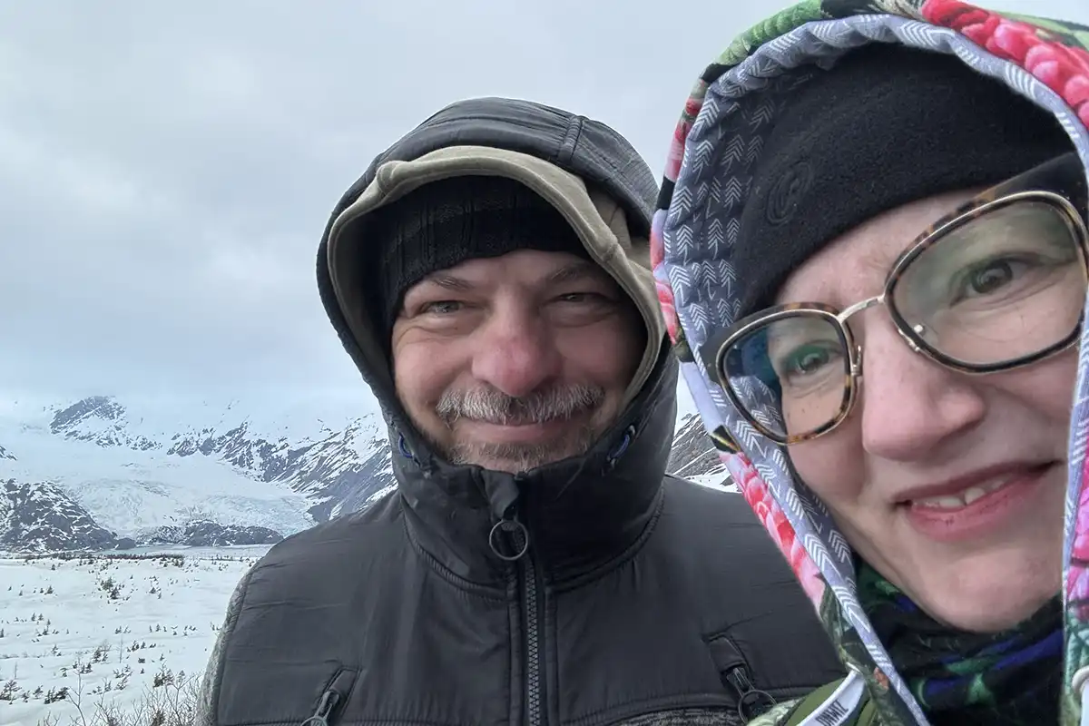Agnes Stabinska, the author, with her partner Chris during hike to Portage Pass with the glacier in the backdrop.