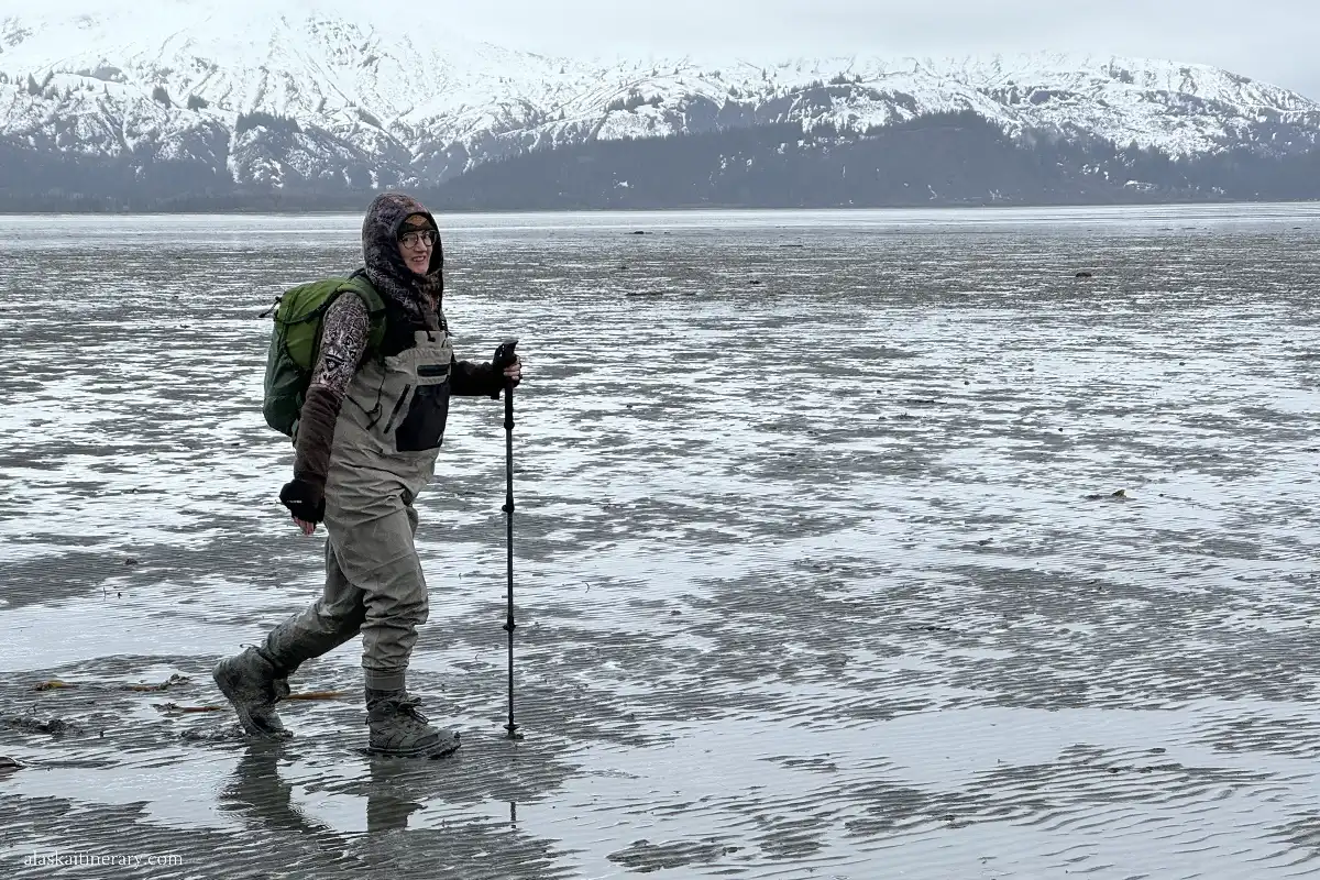 Agnes Stabinska hiking in mud Lake Clark National Park during rainy and foggy day.
