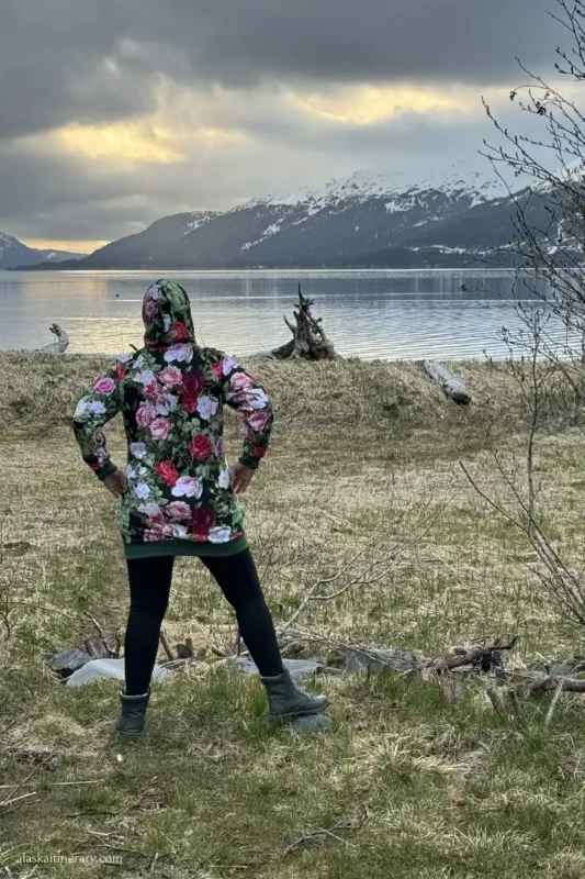 Agnes Stabinska, the autor is admiring the bay and mountains during sunset on camping in whittier.