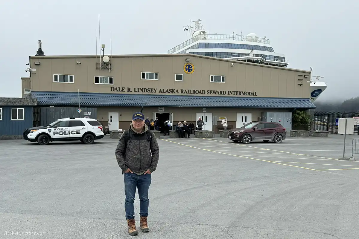 Chris before main entrance to Seward Cruise port terminal.