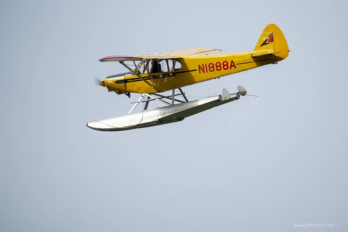 Yellow flotplane on the sky during demostration.