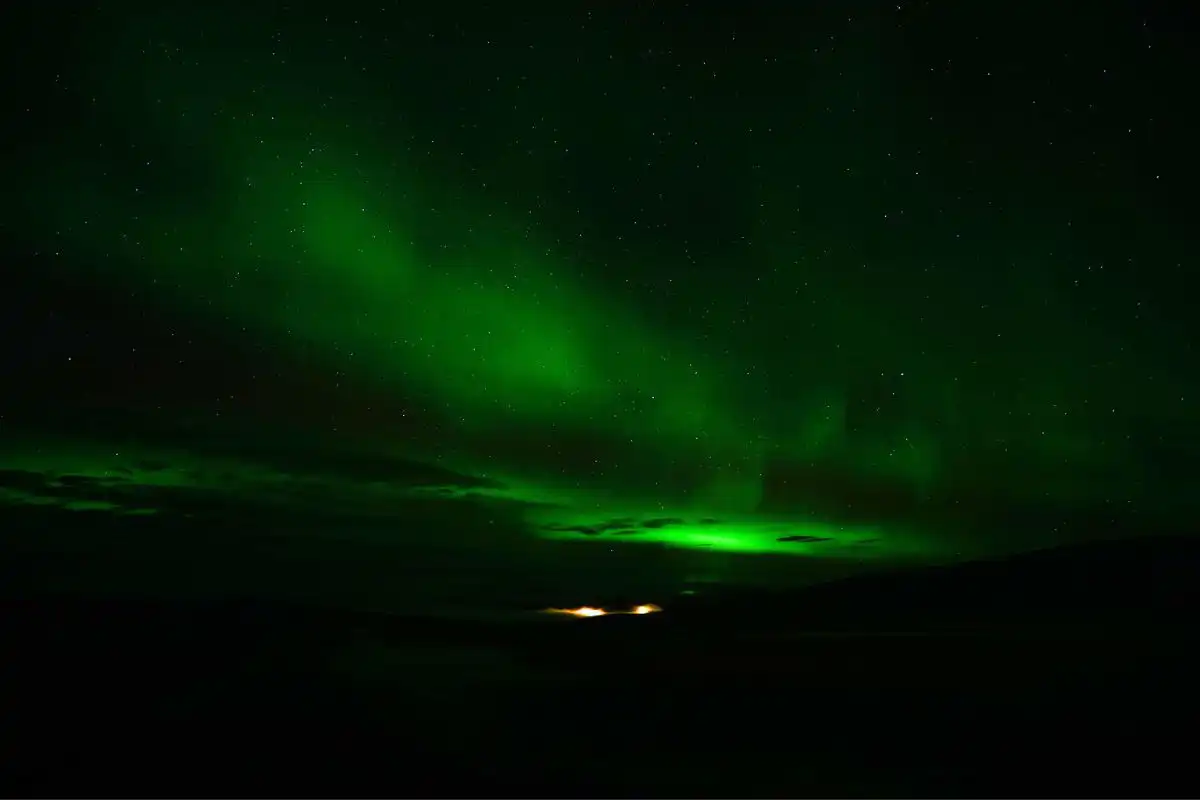 Green Aurora Borealis on a dark sky in Alaska.
