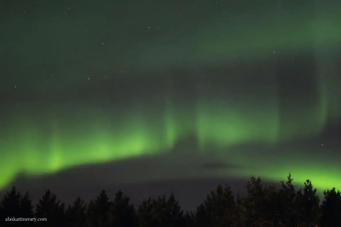Northern lights on the sky during Arctic Circle winter tour.