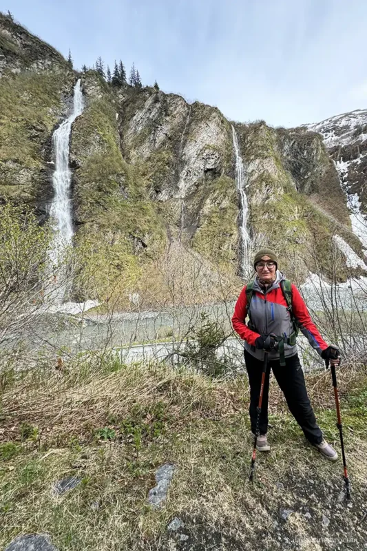 Agnes Stabinska, the author, is hiking in Keystone Canyon with a waterfall in the backdrop.