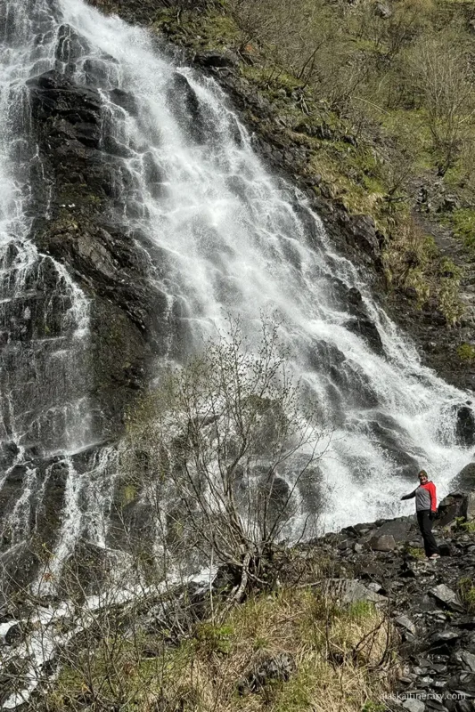 Agnes Stabinska, the author, next to Horsetail Falls in Valdez.