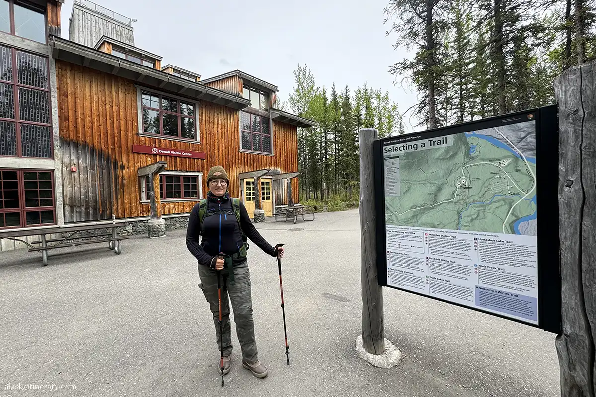 Agnes Stabinska, the author, in Denali Visitor Center, next to the trail map.