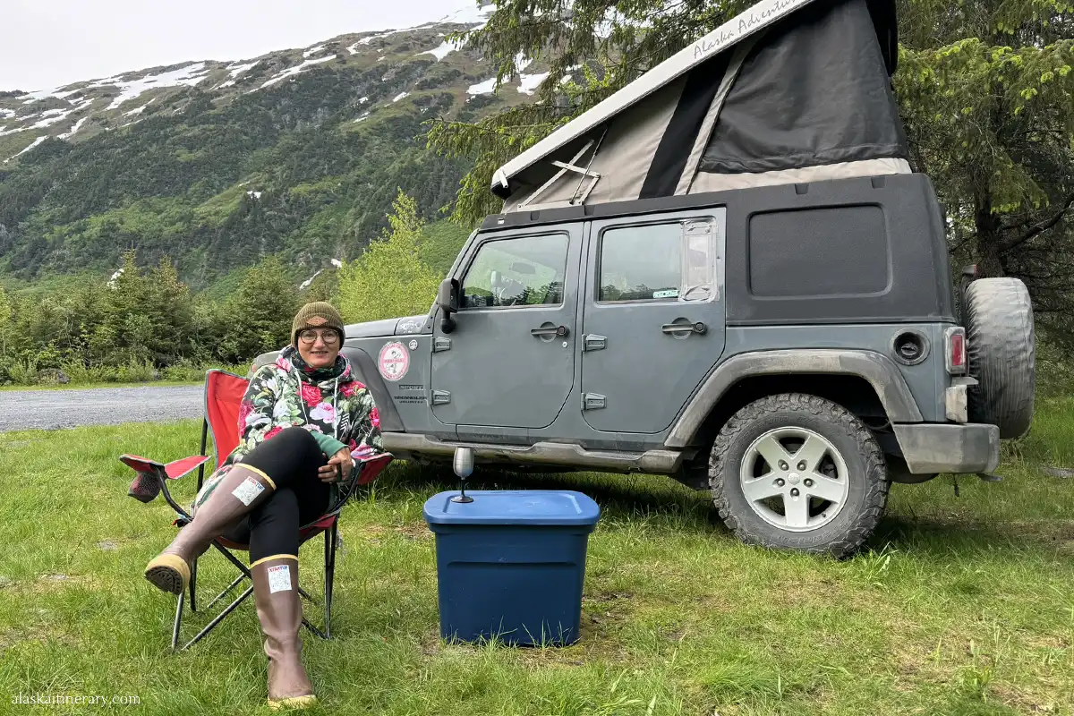 Agnes Stabinska, the author, next to jeep wrangler with a roof top tent.