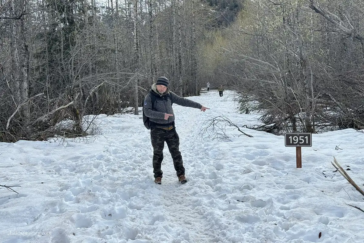 Chris on Exit Glacier trail, where markers showing where Exit Glacier once extended in 1951.