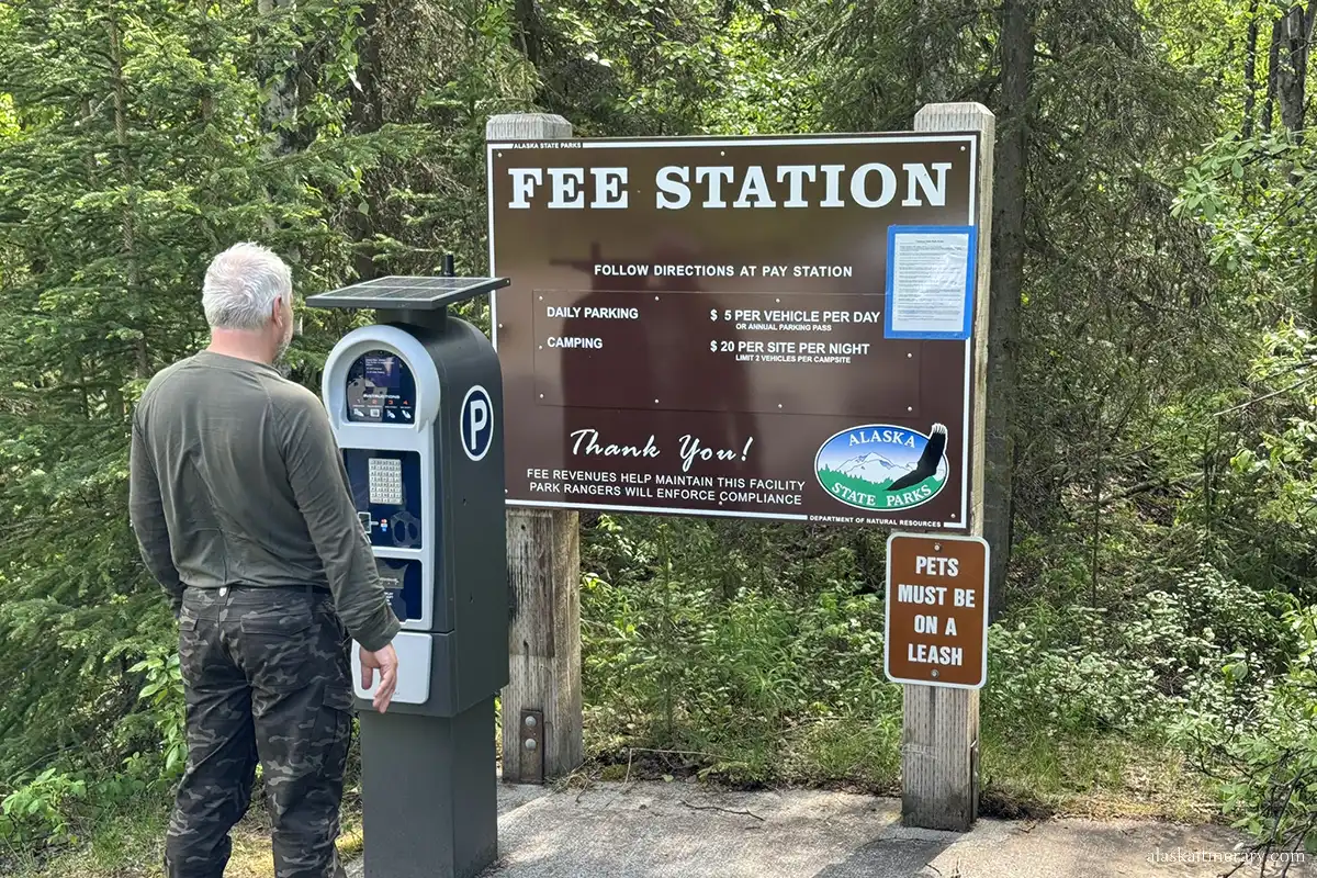 Chris at fee station on Eklutna Lake Campground.