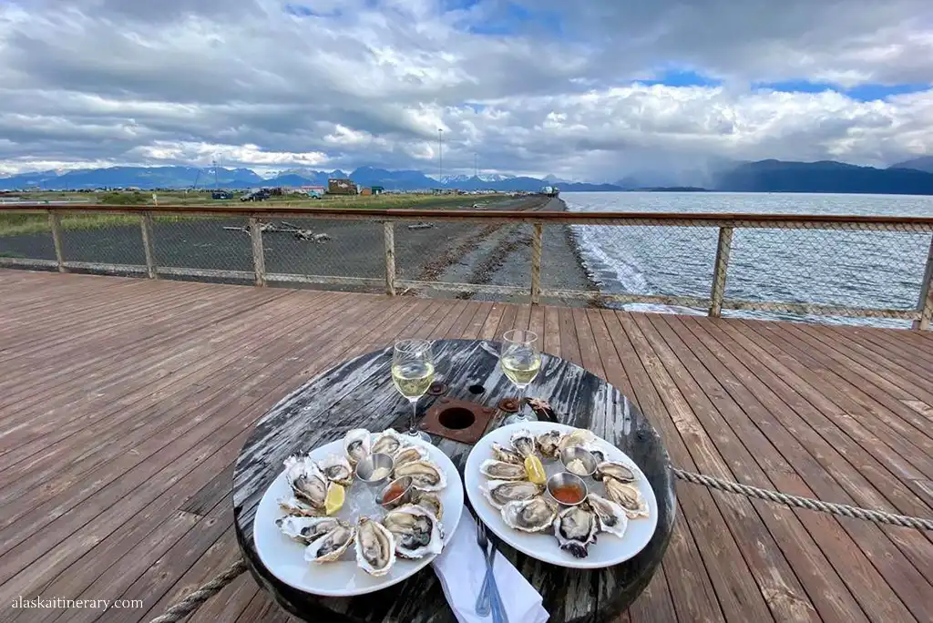 Oysters in bar in Homer with the sea and mountain views.