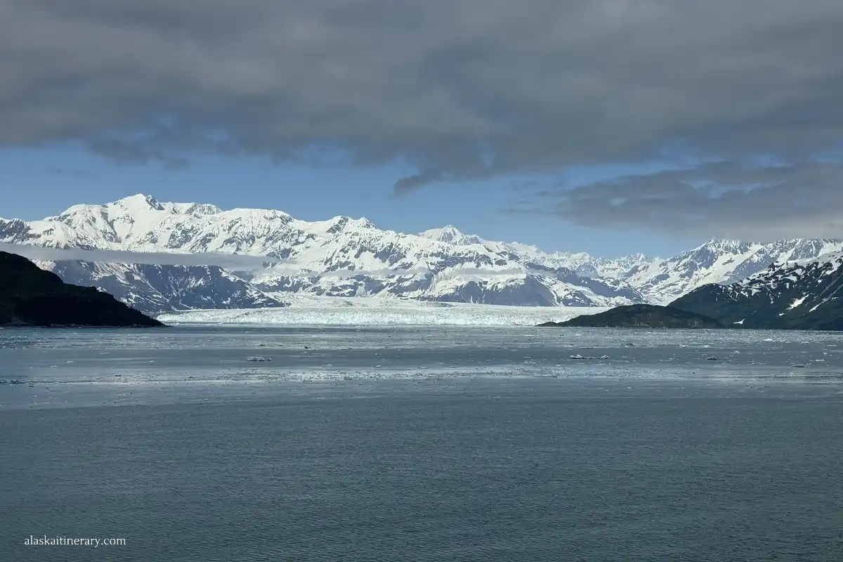Huge Hubbard Glacier with mountains in the backdrop.