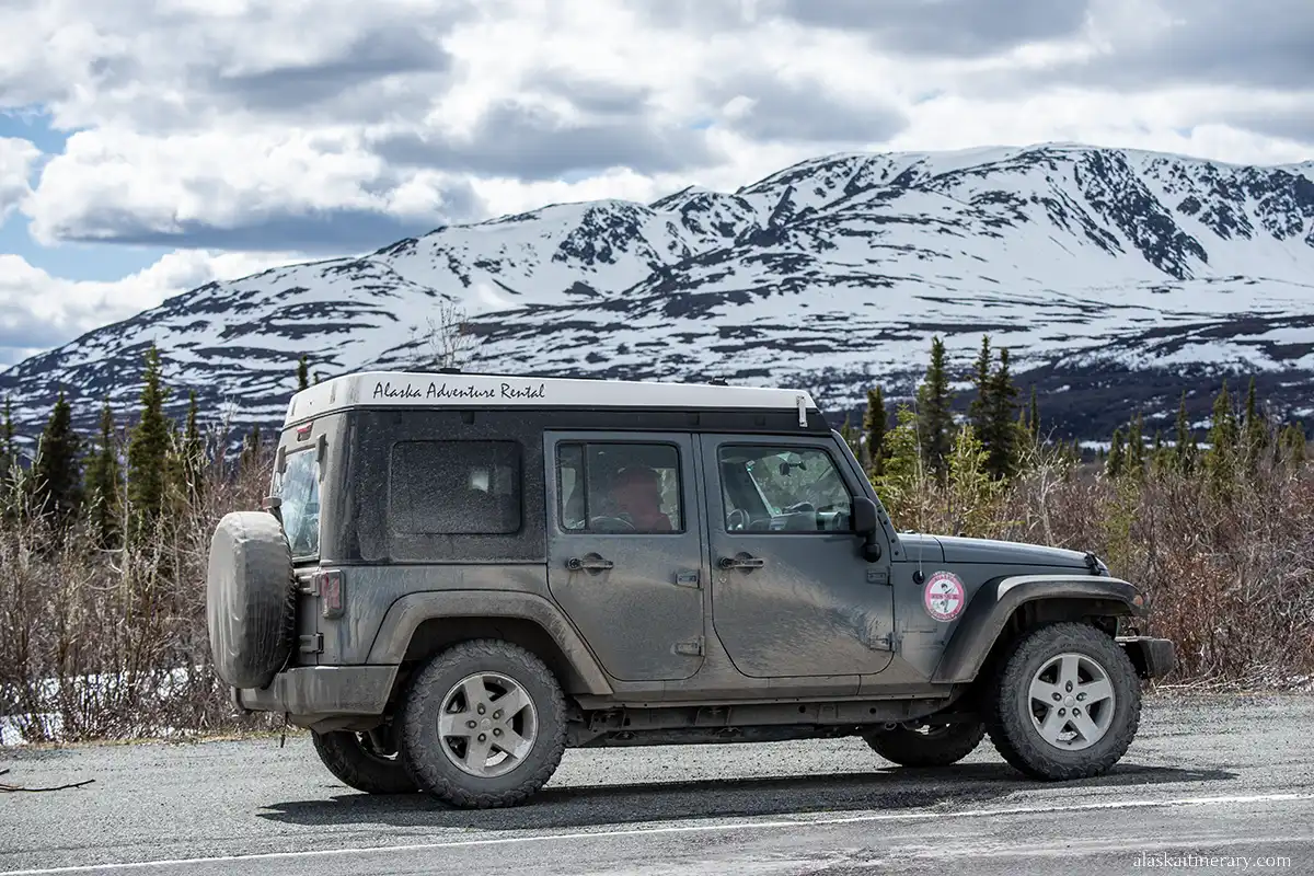 Rented jeep wrangler on Alaska road.