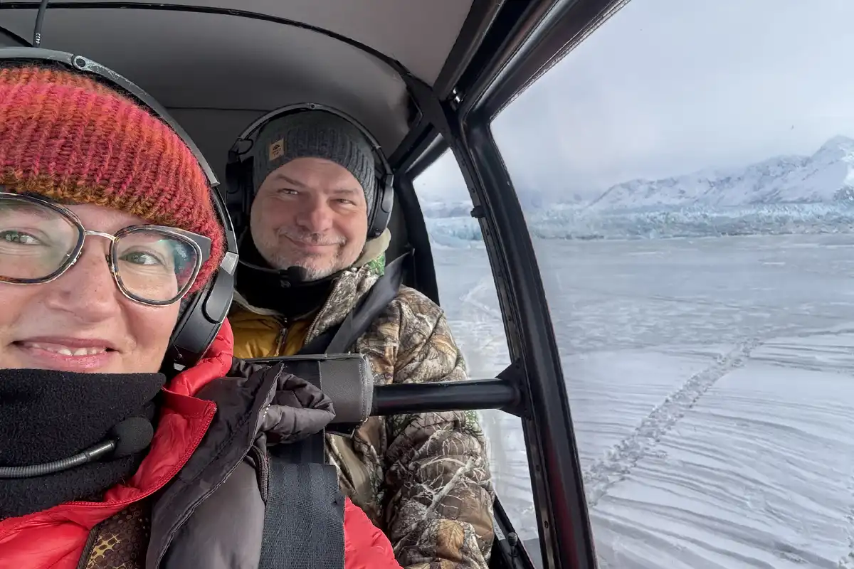 Agnes Stabinska, the author, with her partner Chhris in helicopter during scenic flight above Knik glacier.