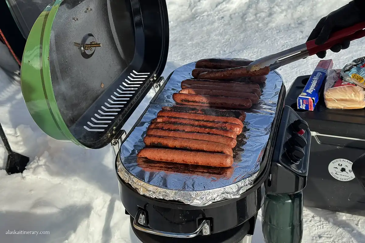 Reindeer sausage for a lunch during ice fishing tour.