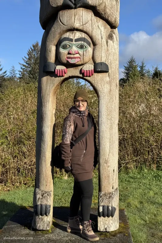 Agnes Stabinska, the author, next to totem pole in Ketchikan.