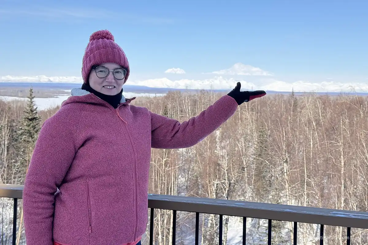 Agnes Stabinska, the author, with Denali peak in the backdrop in winter.