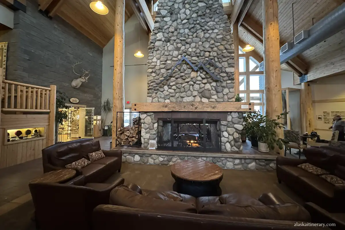 Large fireplace and lounge area – lobby in Talkeetna Alaskan Lodge.